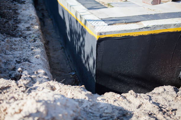 Professional Waterproofing technician working in Crofton, MD